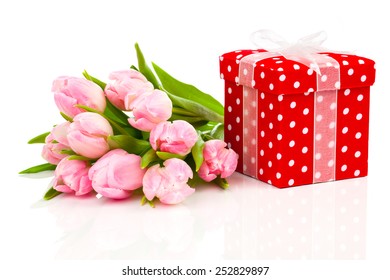 beautiful tulips with red polka-dot gift box. happy mothers day, romantic still life, fresh flowers - Powered by Shutterstock