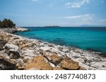 Beautiful turquoise blue sea along the rocky coast of Atspas beach on the island of Thasos in Greece