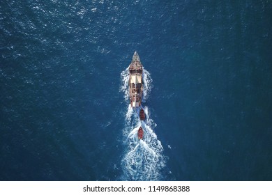 beautiful turquoise ocean water with boat on it top view aerial photo - Powered by Shutterstock