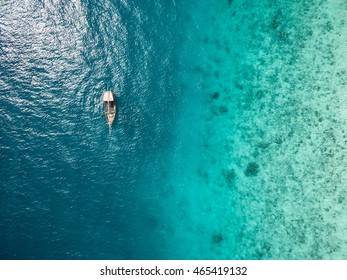 Beautiful Turquoise Ocean Water With Boat On It Top View Aerial Photo