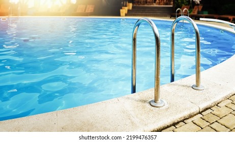 A Beautiful Turquoise Pool In A Hotel Or Country Club.