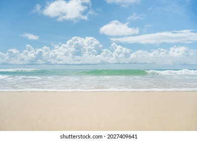 Beautiful Turquoise Sea And White Sand Background.Amazing Wave On Clean Sandy Surfing  Beach.Landscape Clouds Pattern Sunset On Summer.Waves Sea Water Crashing Beach Texture Background.no People 