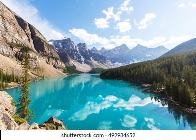 Beautiful turquoise waters of the Moraine lake with snow-covered peaks above it in Banff National Park of Canada - Powered by Shutterstock