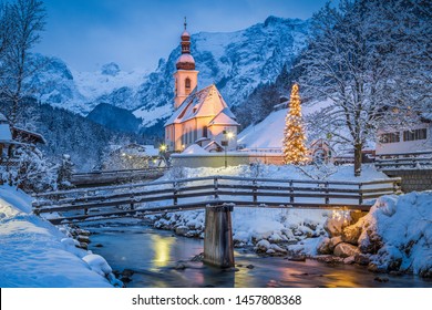 Beautiful twilight view of Sankt Sebastian pilgrimage church with decorated Christmas tree illuminated during blue hour at dusk in winter, Ramsau, Nationalpark Berchtesgadener Land, Bavaria, Germany - Powered by Shutterstock