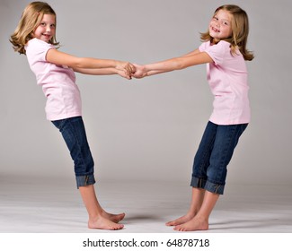 Beautiful Twin Sisters Playing Together