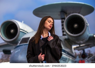 Beautiful Ukrainian Model Posing In Front Of An Old Jet Plane