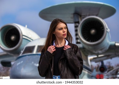 Beautiful Ukrainian Model Posing In Front Of An Old Jet Plane