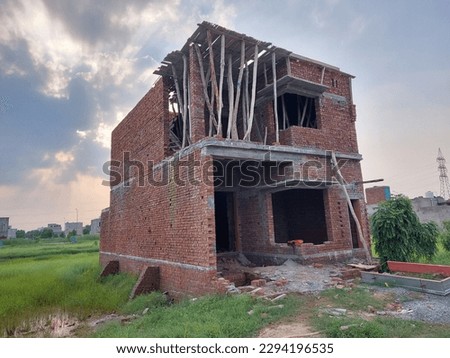 Beautiful under construction house with red bricks 