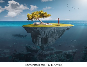 Beautiful underwater view of floating island above and below water surface in turquoise waters of tropical ocean with lone woman and marine life. - Shutterstock ID 1745729762