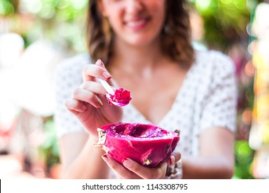 Beautiful Unfocused Background Eating Fruit, Specifically Dragon Fruit In A Fruit Market.