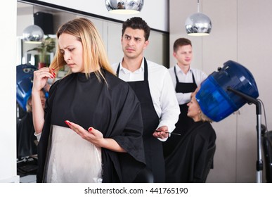 Beautiful Upset Woman Blaming Hairdresser In Bad Haircut 