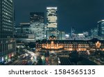 Beautiful urban cityscape with Tokyo station under twilight sky and neon night in Marunouchi business district, Japan