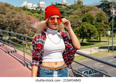 A Beautiful Urban Latina Woman Walking On A Bridge In Sunny Day