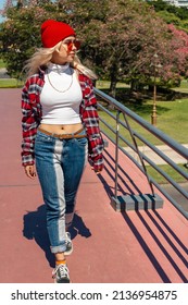 A Beautiful Urban Latina Woman Walking On A Bridge In Sunny Day