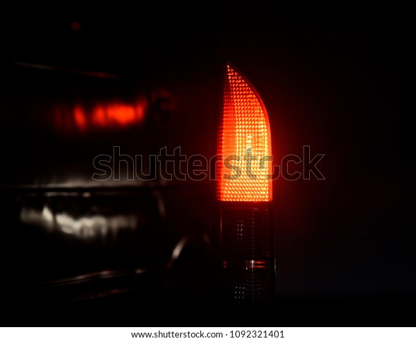 A beautiful vehicles red brake lights isolated\
object unique photograph