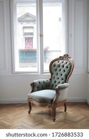 A beautiful vertical picture of a green armchair against a white window - Shutterstock ID 1726883533
