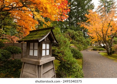 Beautiful vibrant fall colors in the colorful forest of Portland Japanese Garden in Oregon, USA - Powered by Shutterstock