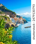 Beautiful view of Amalfi on the Mediterranean coast with lemons in the foreground, Italy