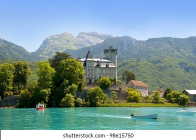 Beautiful view of the Annecy Lake in French Alps, a summer day with boats in the foreground. Annecy. Haute Savoie. French Alps. France.