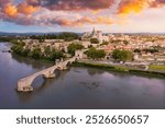 Beautiful view of Avignon with famous bridge Saint-Benezet, medieval architecture along the Rhone River in Avignon, France. The Pont Saint Benezet and the Papal palace in Avignon, South France.