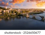 Beautiful view of Avignon with famous bridge Saint-Benezet, medieval architecture along the Rhone River in Avignon, France. The Pont Saint Benezet and the Papal palace in Avignon, South France.