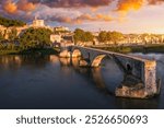 Beautiful view of Avignon with famous bridge Saint-Benezet, medieval architecture along the Rhone River in Avignon, France. The Pont Saint Benezet and the Papal palace in Avignon, South France.