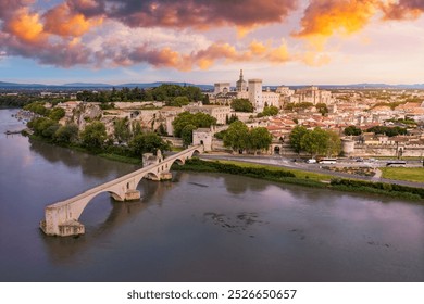 Beautiful view of Avignon with famous bridge Saint-Benezet, medieval architecture along the Rhone River in Avignon, France. The Pont Saint Benezet and the Papal palace in Avignon, South France.