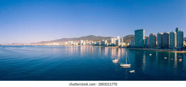 Beautiful view of the beach, aerial view of the sea, acapulco beach seen from above. Travel and vacation concept. Colorful sunset on the beach. Aerial photography.