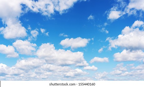 Beautiful View Of Blue Sky And Clouds. Real Scene Without Any Light Effects.