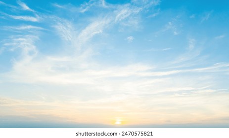 Beautiful view of blue sky with clouds at sunrise. Partly cloudy.Background cloud summer. Cloud summer. Sky cloud clear with sunset. Natural sky cinematic beautiful yellow and white texture background