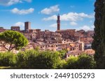 Beautiful view of campanile of Siena Cathedral, Duomo di Siena, and Old Town of medieval city of Siena in the sunny day, Tuscany, Siena province, Italy