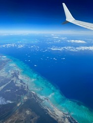 Beautiful View Of Caribbean Island From Above. Mix Of Colors Blue, Green And Turquoise In The Ocean. Concept For Vacation, Traveler, Freedom.
