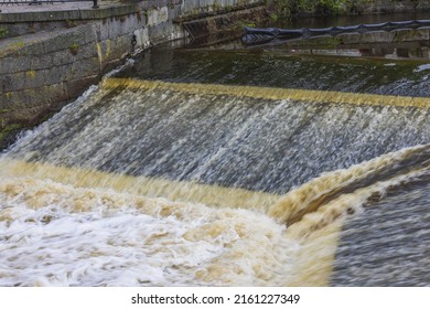 Beautiful view of cascade of water flowing river in center of Uppsala. Sweden.