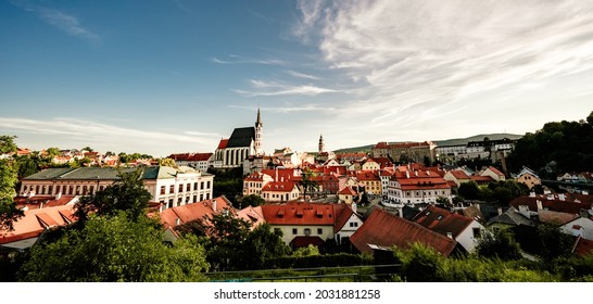 Beautiful view of the church and castle. Cesky Krumlov with St Vitus church in the middle of historical city centre. Cesky Krumlov, Southern Bohemia, Czech Republic