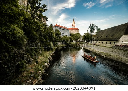 Beautiful view of the church and castle. Cesky Krumlov with St Vitus church in the middle of historical city centre. Cesky Krumlov, Southern Bohemia, Czech Republic
