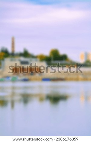 Beautiful view of the city from the Belaya River to Ufa. Beautifully blurred background. soft bokeh.Motor ships, boats on the water.Text translation -