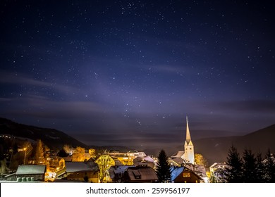 Beautiful view of clean night starry sky over highland Austrian town - Powered by Shutterstock