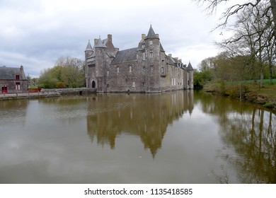 Beautiful view of Comper Castle with water reflection in Paimpont, France