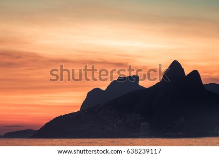 Beautiful view of Copacabana beach, at Rio de Janeiro, Brazil/ Beach at Rio de Janeiro, Brazil/ Beautiful view of a waterfront and the famous mountains called "Two Brothers", in Rio de Janeiro, Brazil