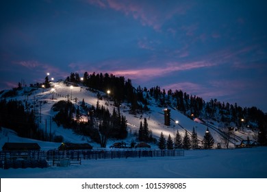 Beautiful View Of Of A Downhill Slope Lit For Night Skiing In Steamboat Springs, Colorado, After Sunset