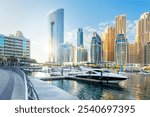 Beautiful view of Dubai Marina with modern buildings and yachts in the water.