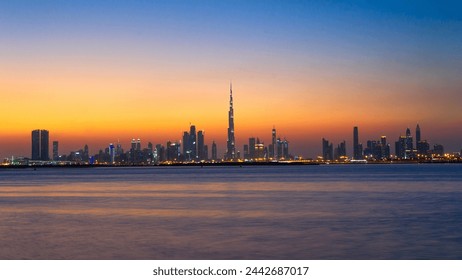 Beautiful view of the Dubai skyline in UAE from Dubai creek Harbour.Panoramic view of a big futuristic city by night. Business bay, Dubai, United Arab Emirates. Nighttime skyline. Dusk Skyline. - Powered by Shutterstock