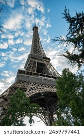 Beautiful view of the Eiffel tower seen from bottom in Paris, France. Long exposure copyspace.