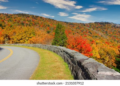 A Beautiful View Of Empty Highway Along Colorful Autumn Trees In Blue Ridge Parkway