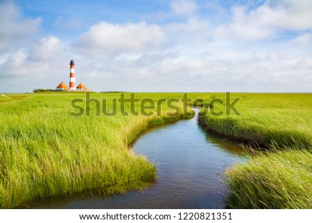 Beautiful view of famous Westerheversand on a sunny day with blue sky and clouds in summer, North Sea, Schleswig-Holstein, Germany