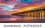 A beautiful view of Flagler Beach Fishing Pier at sunrise in Florida, USA