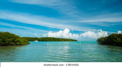 Beautiful View Of The Florida Keys With Boat Cruising By.