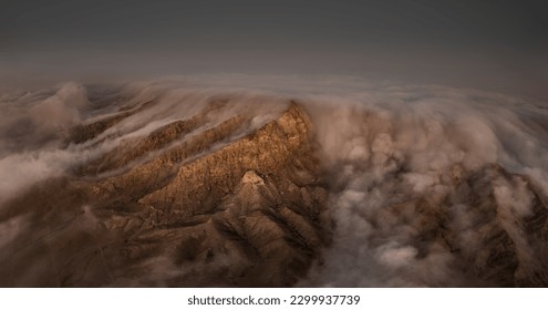 A beautiful view of the fog in the middle of the desert with the sunrise, it is Maliha desert in Sharjah - Powered by Shutterstock