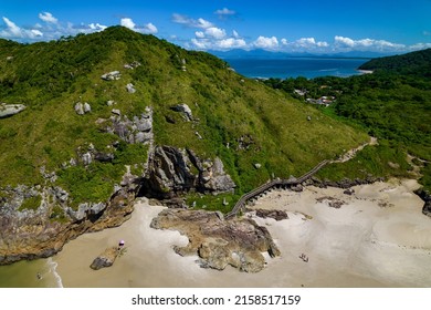 The beautiful view of the green hills and sandy shore against the background of sea  Ilha do Mel, Parana, Brazil 
