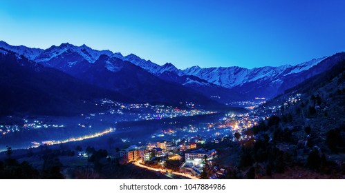 Beautiful View of Himalayas mountains and manali city after sunset in Manali,India Himachal. Long Exposure